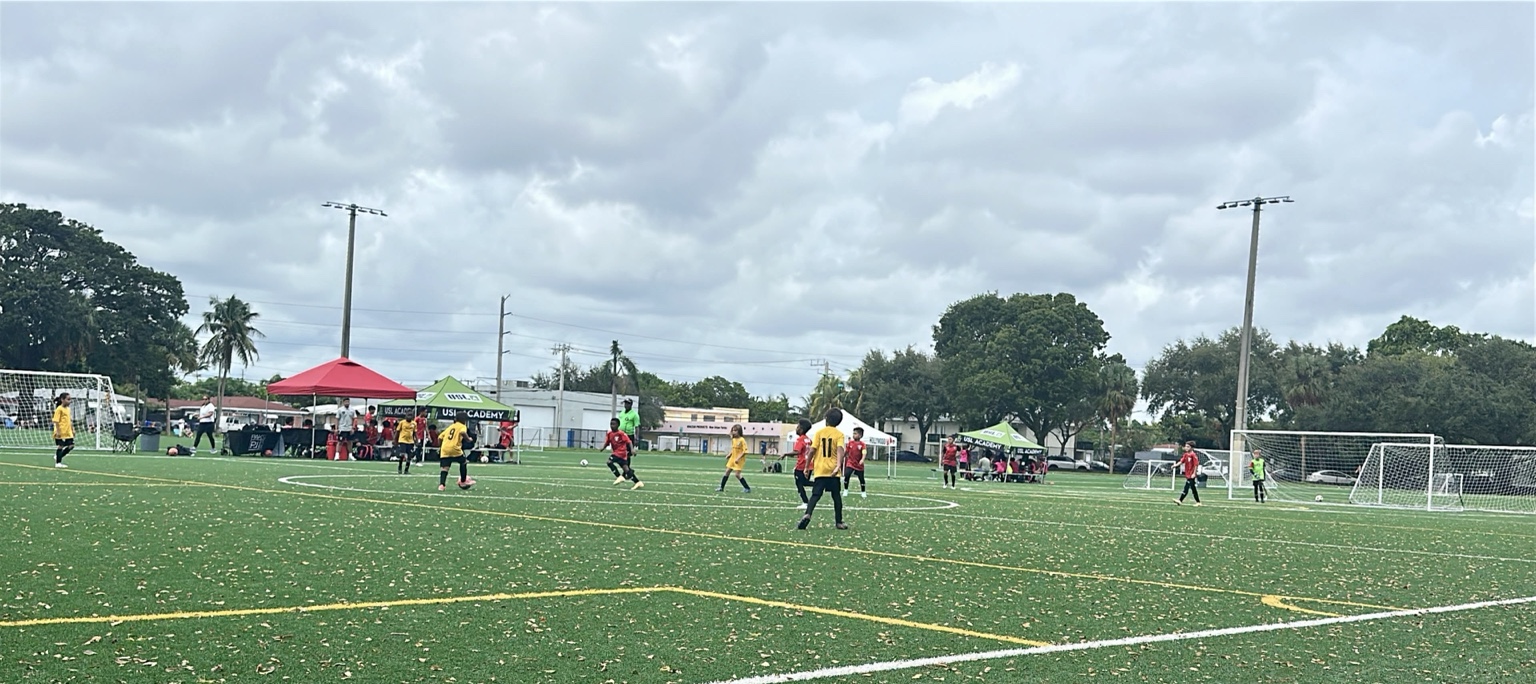 Inter Broward CF players wearing their gold kit during a youth soccer match